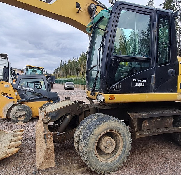 Колёсный экскаватор CAT M318D, 2012