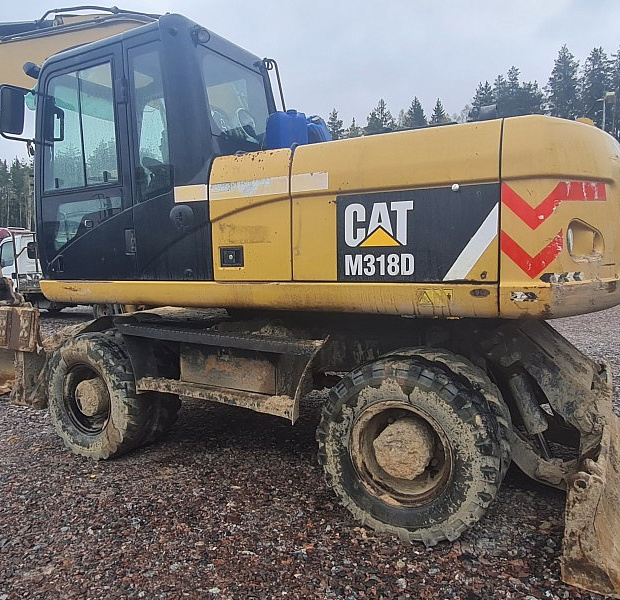 Колёсный экскаватор CAT M318D, 2012